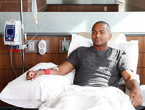 Man in outpatient clinic having chemotherapy infusion.