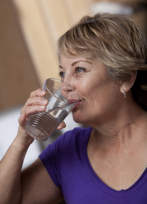 Woman drinking a glass of water