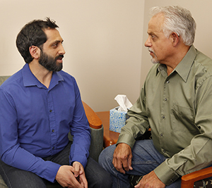 Man talking to mental health professional.