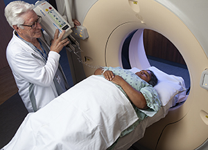 Technician preparing woman for scan.