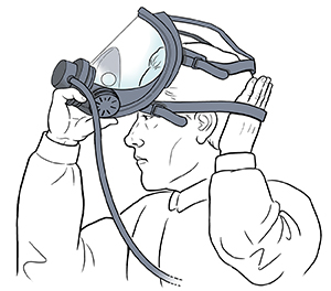 Man placing respirator over face.